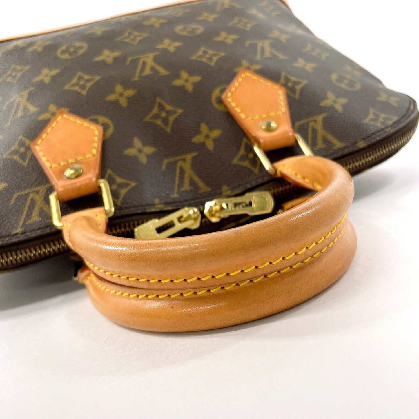 Louis Vuitton Alma Brown Canvas Hand Bag