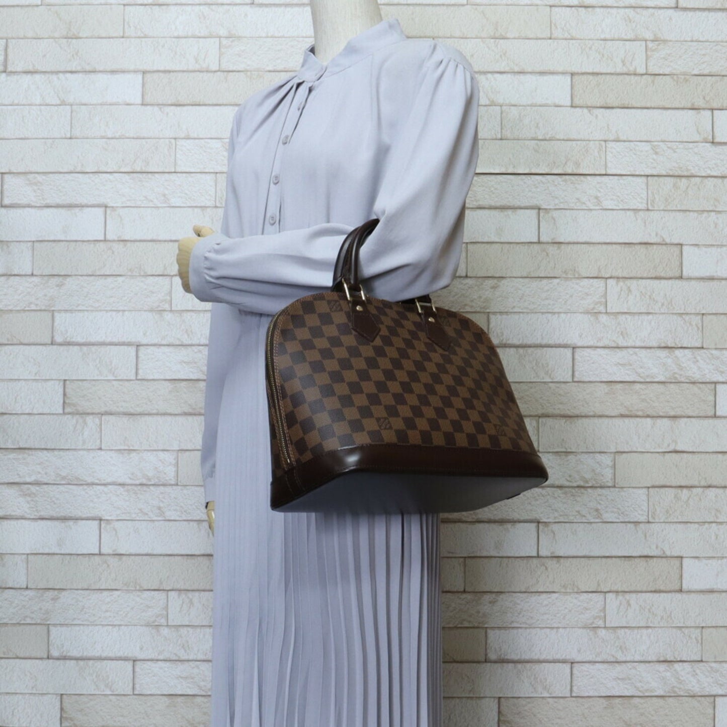 Louis Vuitton Alma Brown Canvas Hand Bag