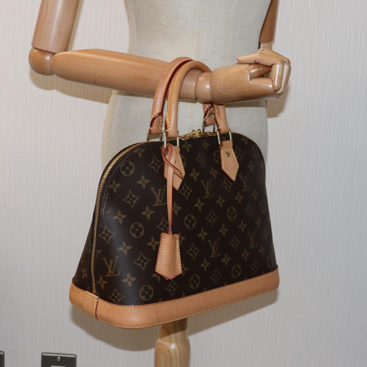 Louis Vuitton Alma Brown Canvas Hand Bag