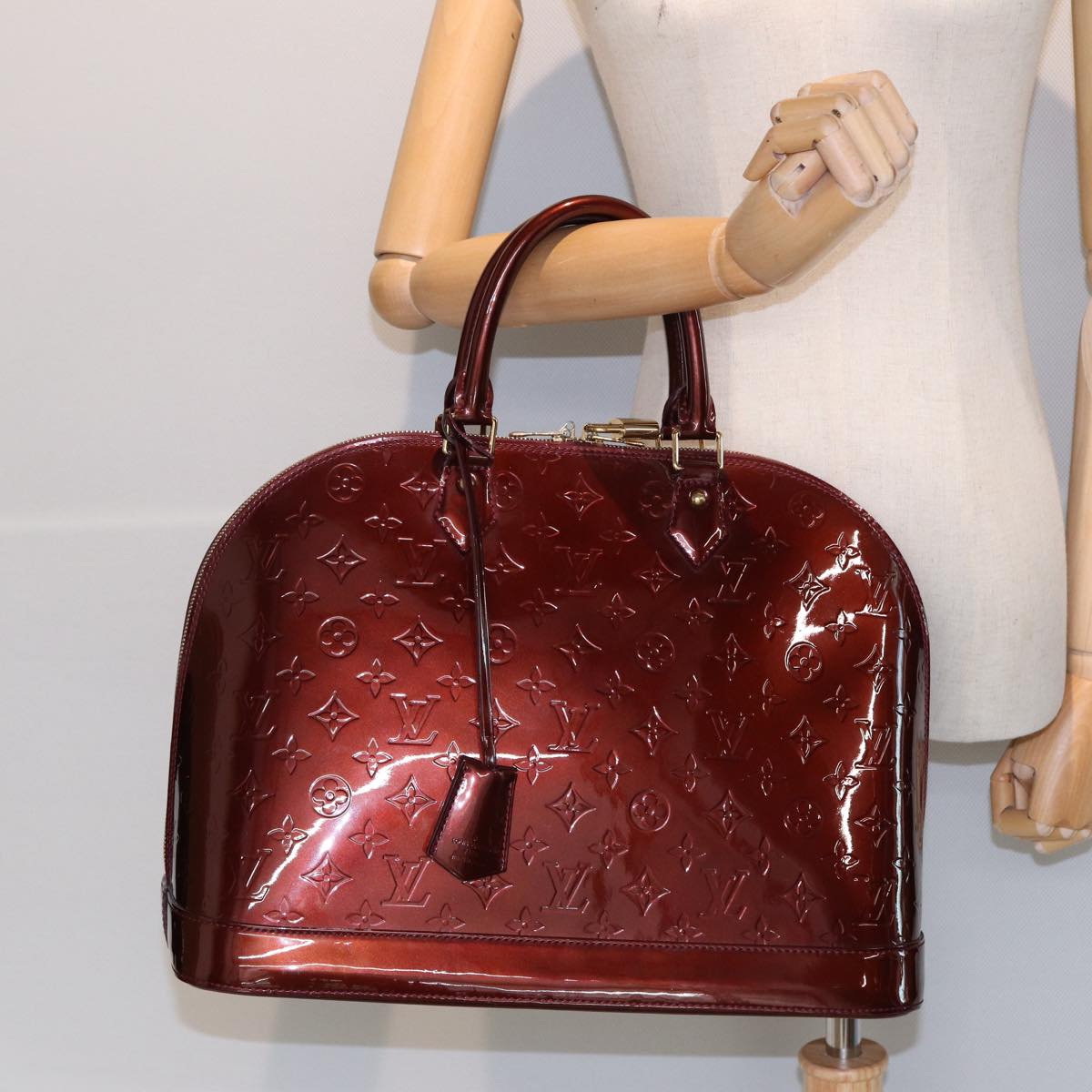 Louis Vuitton Alma Burgundy Patent Leather Hand Bag