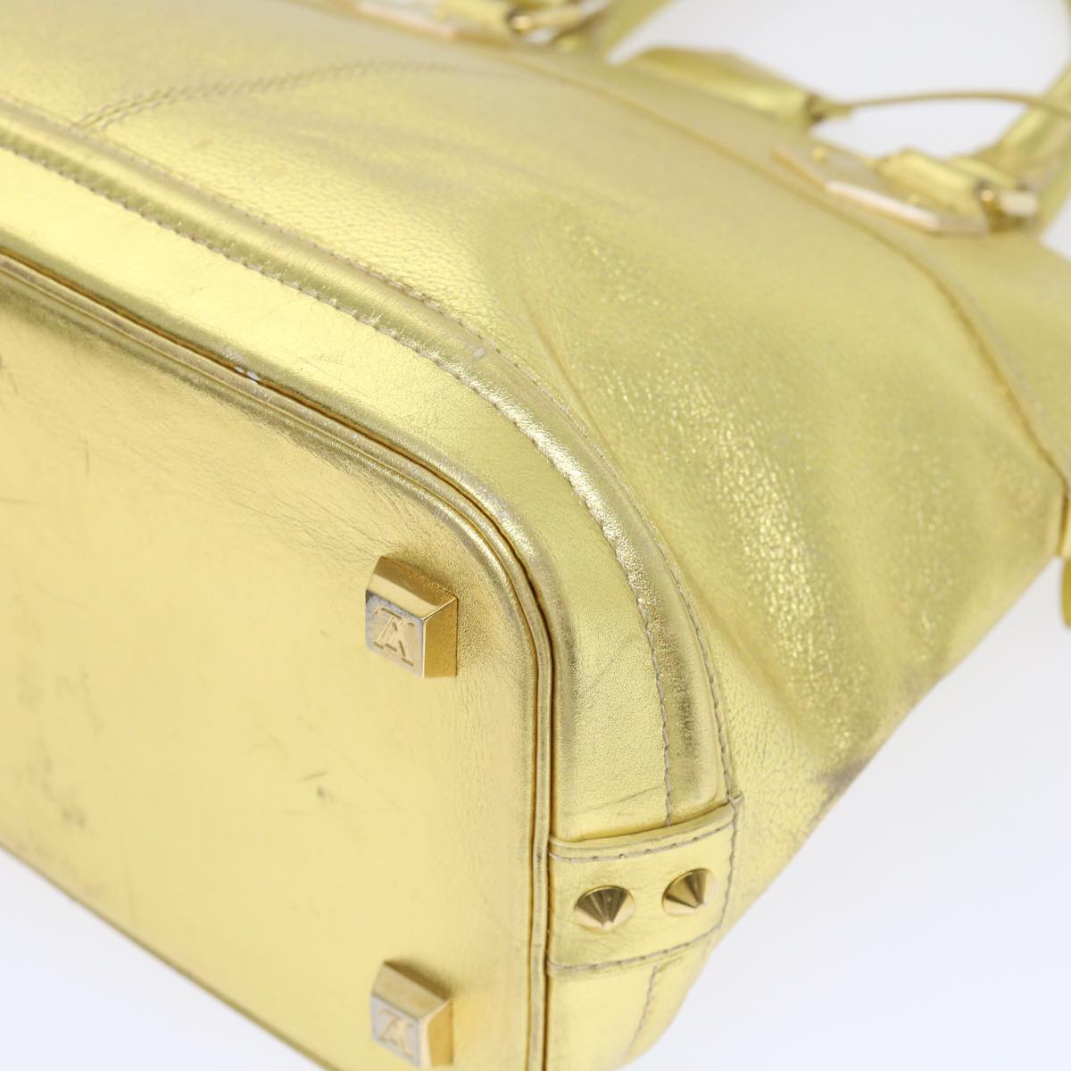 Louis Vuitton Lockit Gold Leather Hand Bag