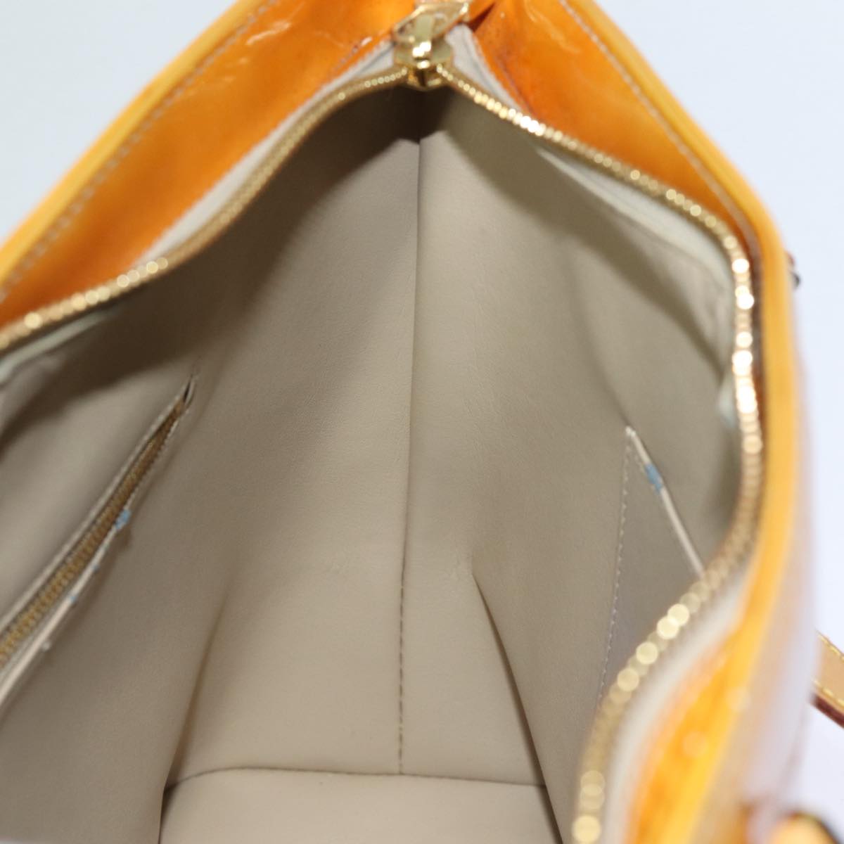 Louis Vuitton Houston Beige Patent Leather Hand Bag