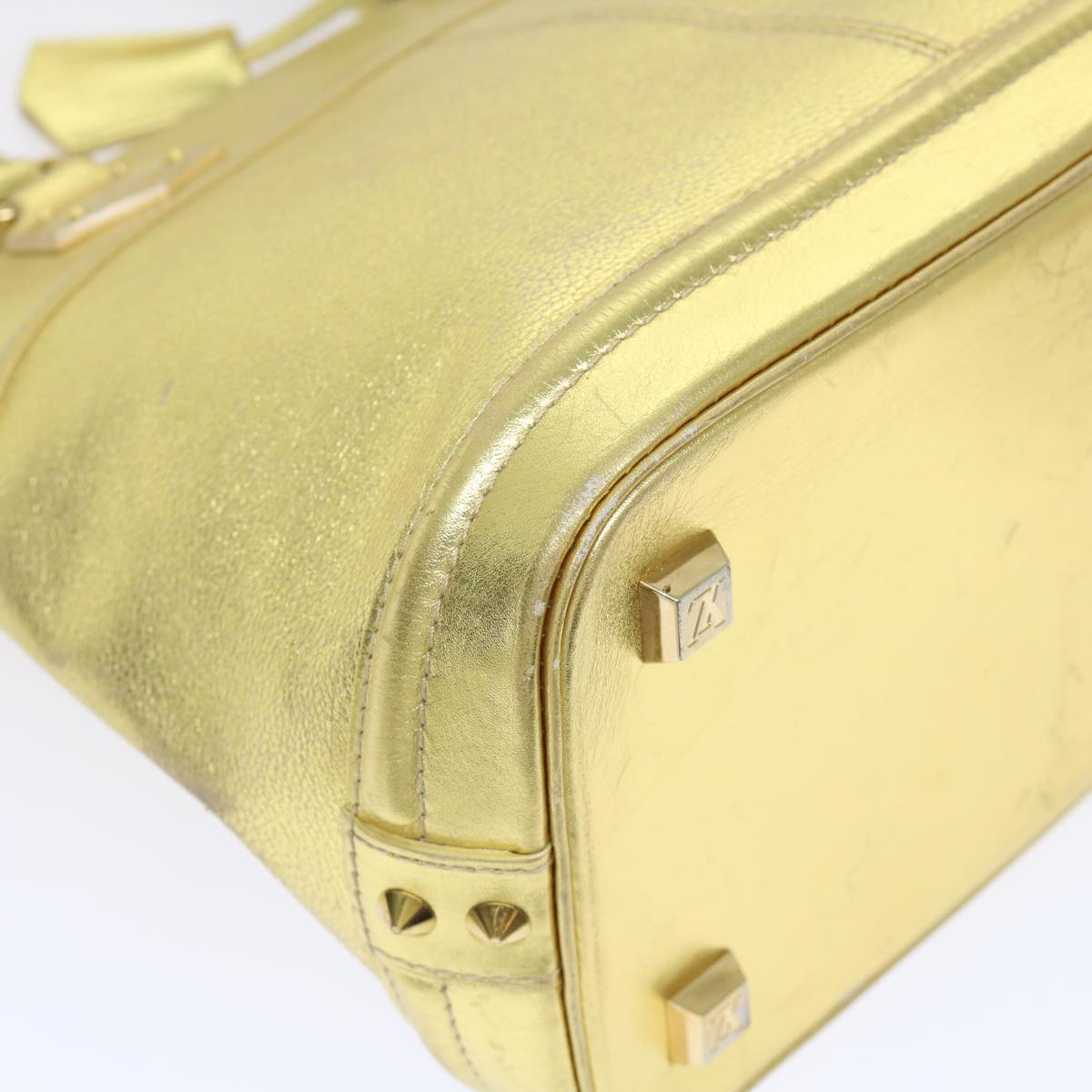 Louis Vuitton Lockit Gold Leather Hand Bag