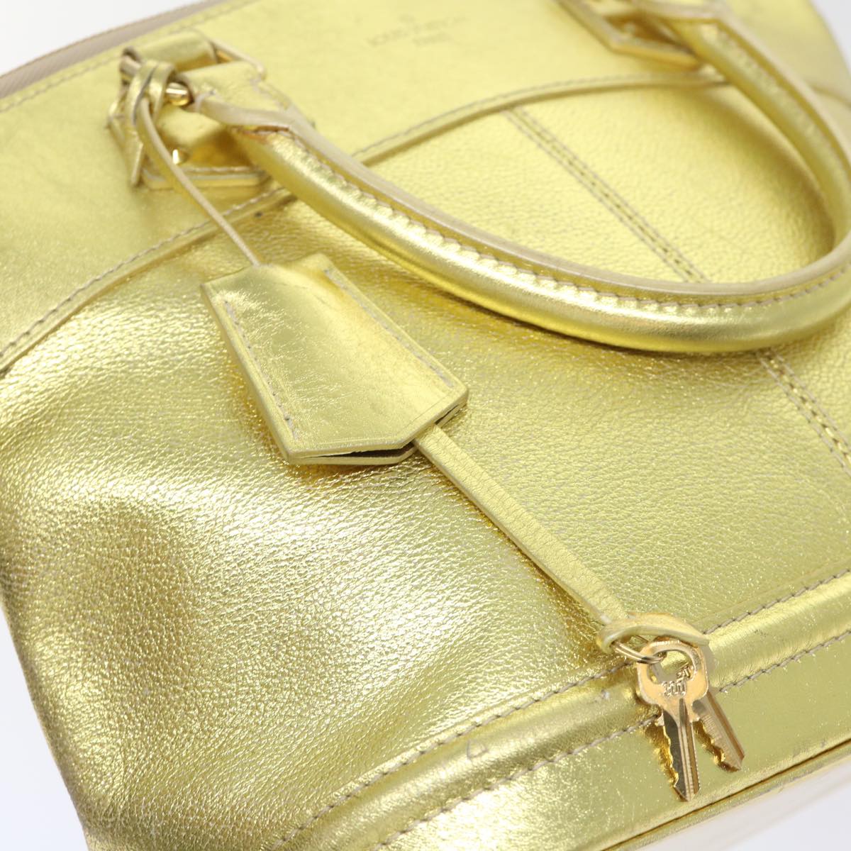 Louis Vuitton Lockit Gold Leather Hand Bag