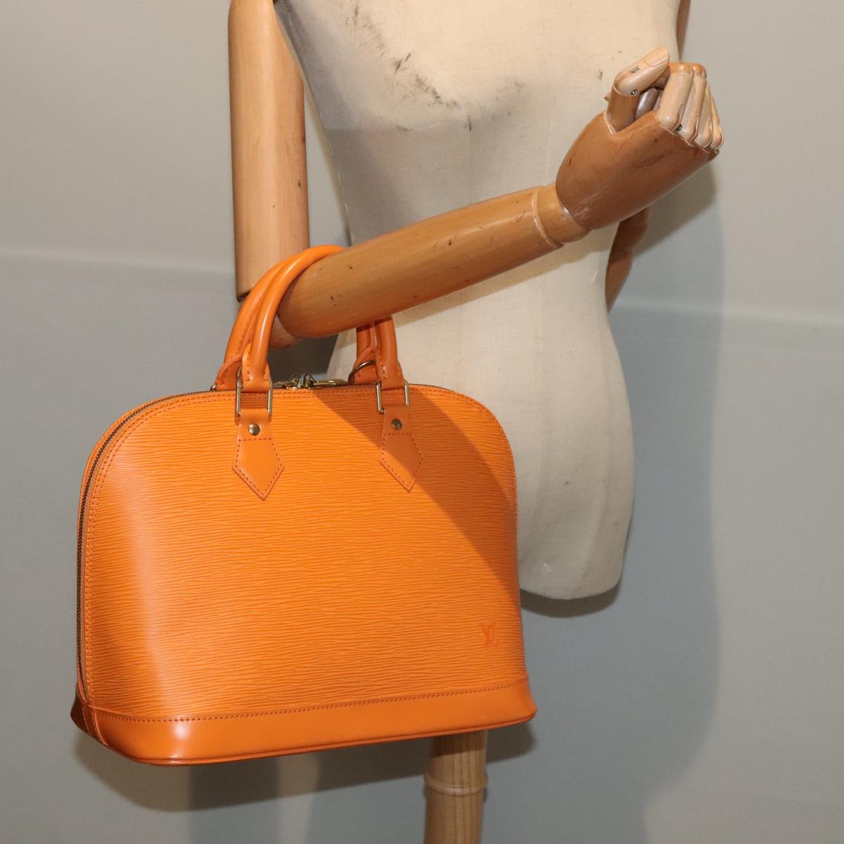 Louis Vuitton Alma Orange Leather Hand Bag