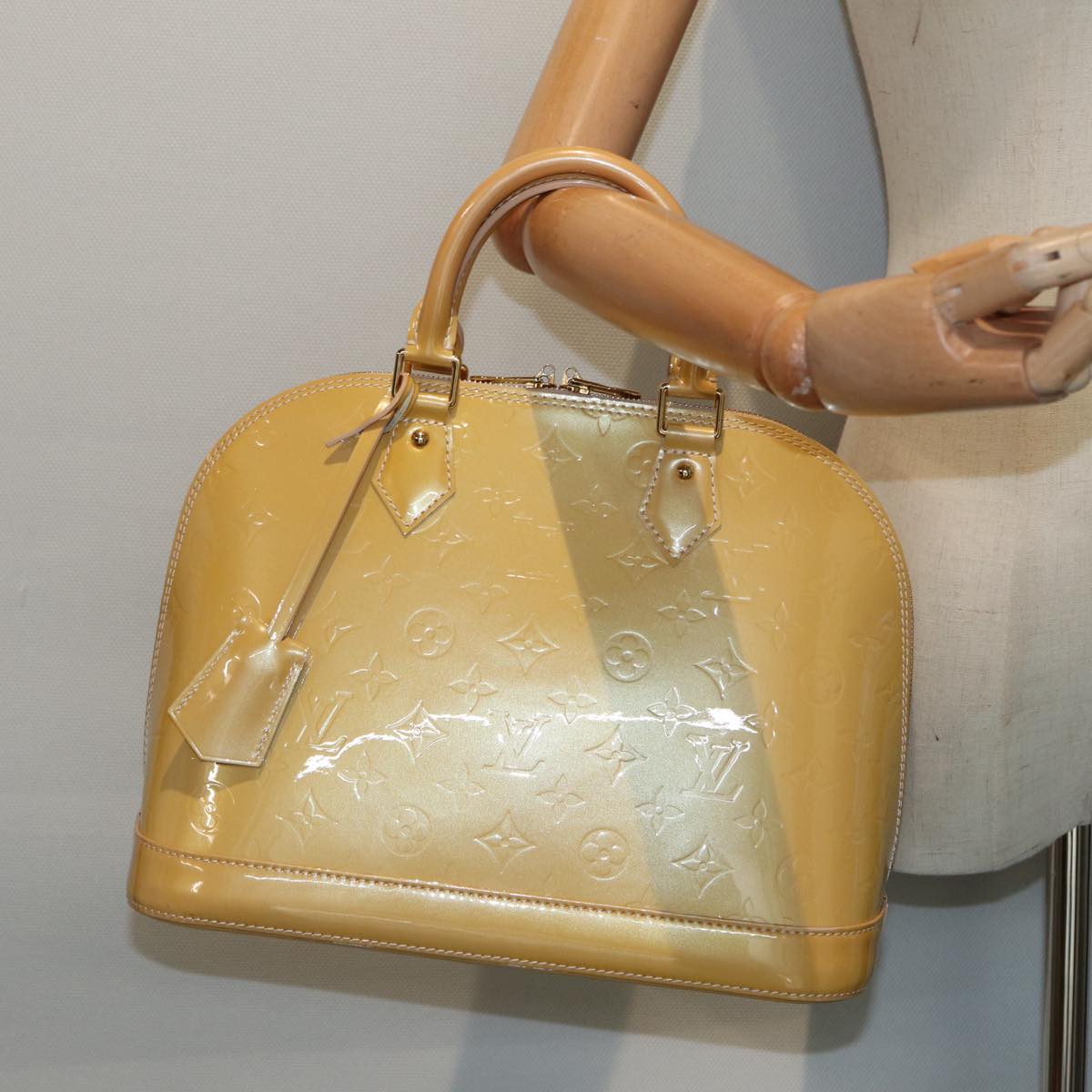 Louis Vuitton Alma Beige Patent Leather Hand Bag